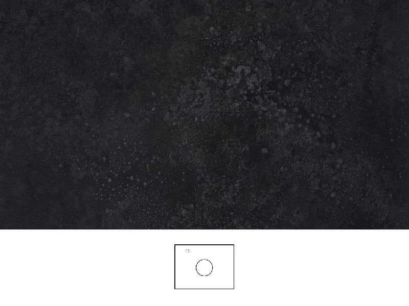 Grafit bordplade 60 cm i dyb sortgrå stenlook med mat finish og diskret mønstret struktur. Håndvask centreret på bordpladen, krom etgrebsarmatur til venstre for håndvasken.